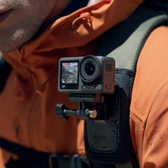 DJI Osmo Action 4 mounted on a backpack shoulder strap